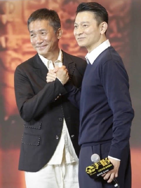 64岁帅气亮相与梁朝伟握手