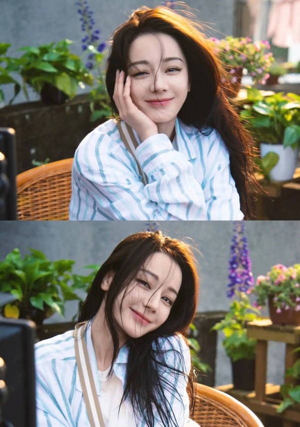 迪丽热巴在暖阳下绽放灿烂笑容,好治愈。